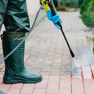 Man,Cleaning,Red,,Conrete,Pavement,Block,Using,High,Pressure,Water